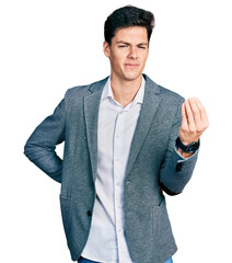 Young hispanic man wearing business clothes doing italian gesture with hand and fingers confident...