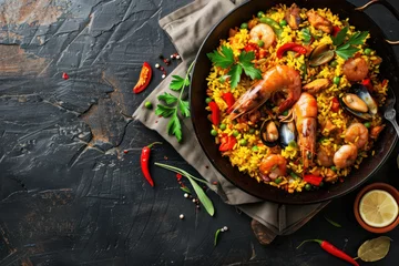Foto op Canvas colorful seafood paella in pan from above © Klay
