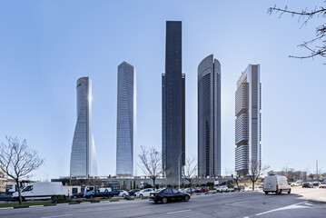 Streets with urban vehicle traffic next to office skyscrapers in the northern area of Madrid that...