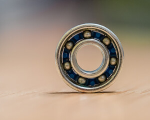 close - up of a button of a sewing machine with blue background