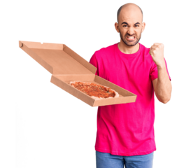 Young handsome man holding delivery pizza cardboard box annoyed and frustrated shouting with anger, yelling crazy with anger and hand raised