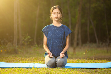 caucasian women practicing Thunderbolt Pose or vajrasana hatha yoga with gyana mudra in the calm...