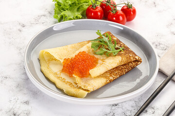 Russian pancake with red caviar
