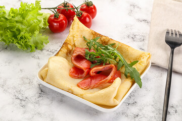 Russian pancake with salmon fish