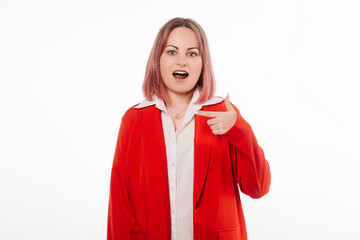 Attractive Woman in Red Blazer looking at camera with a surprise expression, pointing finger at...