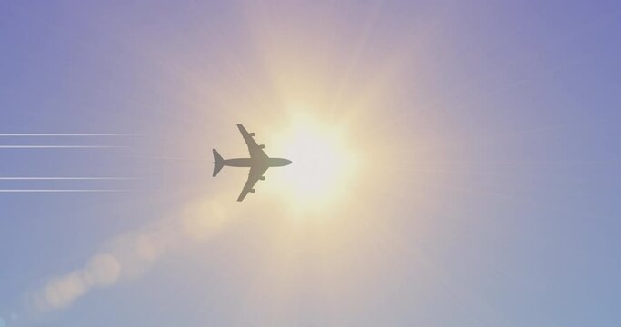 Airplane flying in the sky. Silhouette of a passenger airliner flying overhead, opposite the bright sun