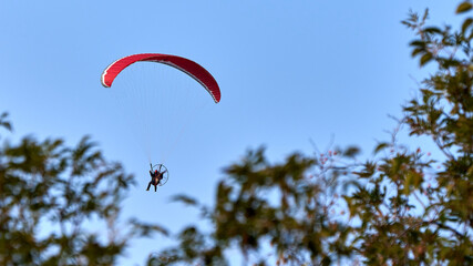 red parachute glider