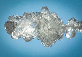 Grown crystals in bright light. Potassium pyrosulphite. A substance used in the food industry. Preserving agent.