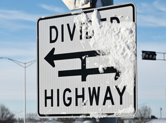 Snow Stuck to Road Sign