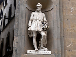 Benvenuto cellini statue in the Uffizi courtyard, in Florence.