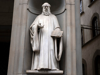 Guido Aretino statue in the Uffizi courtyard, in Florence.