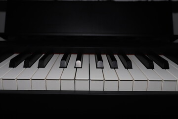 Musical instrument made of black and white keys. Stage piano. Piano keyboard close-up.
