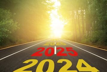 The number 2025 written on the forest road. New year concept from 2024 to 2027. Anniversary planning for the concept of hope and future.