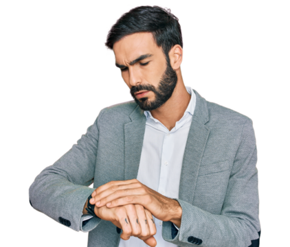 Young hispanic man wearing business clothes checking the time on wrist watch, relaxed and confident