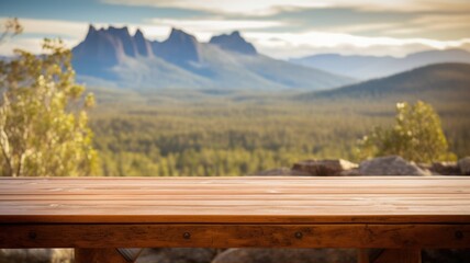 The empty wooden brown table top with blur background of Cradle mountain in Tasmania. Exuberant image. generative AI - obrazy, fototapety, plakaty
