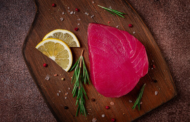 fresh red tuna fillet, for steak, raw, top view, on a cutting board, no people,