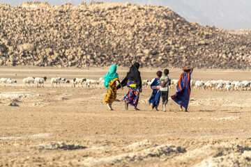 Djibouti, Afar shepherds walking at the lake Abbé	
