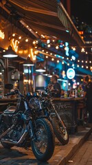 Classic motorcycles lined up outside a bustling bar with neon signs at night.