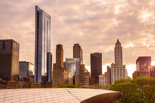 Modern and old high rise buildings in Chicago downtown at sunset in spring