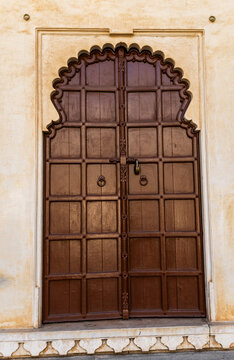 artistic wood door of ancient fort at morning