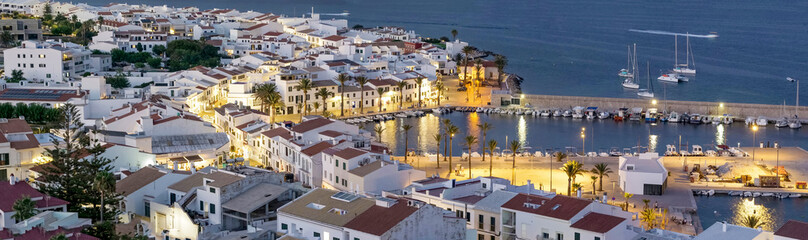 Top panorama of beautiful Fornells downtown and harbor at dusk in Menorca, Spain