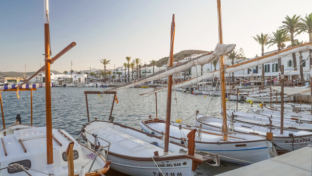 Menorca, Spain - August 20 2023: Yachts and sailboats moored in Fornells harbor of Menorca Island