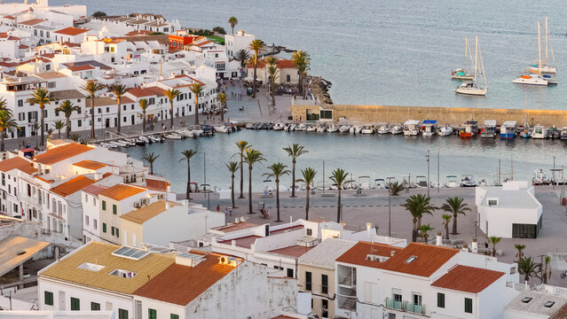Top view panorama of the stylish Fornells harbor in warm light of sunset in Menorca Island Spain