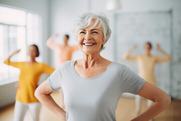 Elderly fitness enthusiasts staying vibrant as they exercise together in the gym, old women practicing yoga