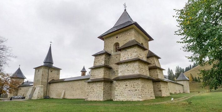 Suceava, Romania - October 28 2023: Stone fortified defense walls surrounding Sucevita Monastery in Bukovina region, Romania