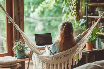 A woman comfortably sits in a hammock while using a laptop outdoors, The paradox of work-life balance at home, AI Generated - obrazy, fototapety, plakaty