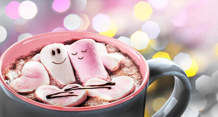 A couple in love made of marshmallows with hearts in a mug with hot chocolate