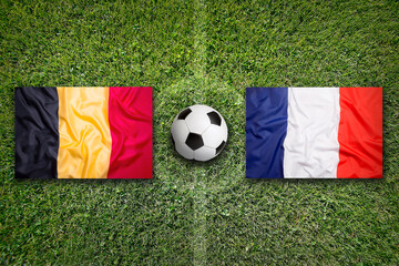 Belgium vs. France flags on soccer field © BirgitKorber