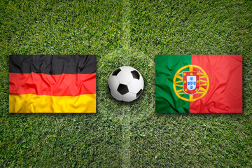 Germany vs. Portugal flags on soccer field