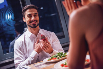 Man proposing in restaurant