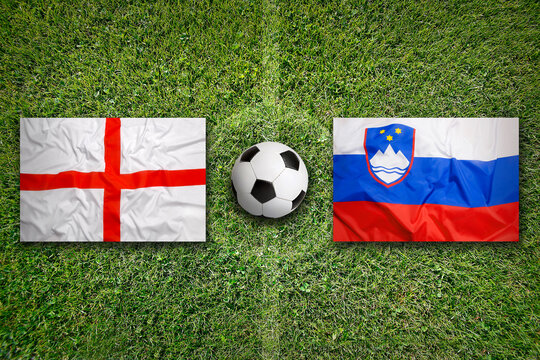 England vs. Slovenia flags on soccer field