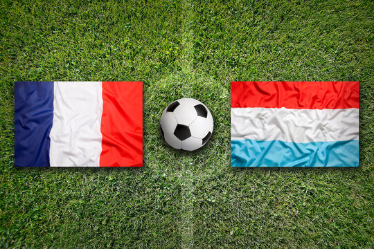 France vs. Luxembourg flags on soccer field