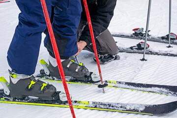 help fasten your boots on a soft slope. family active recreation