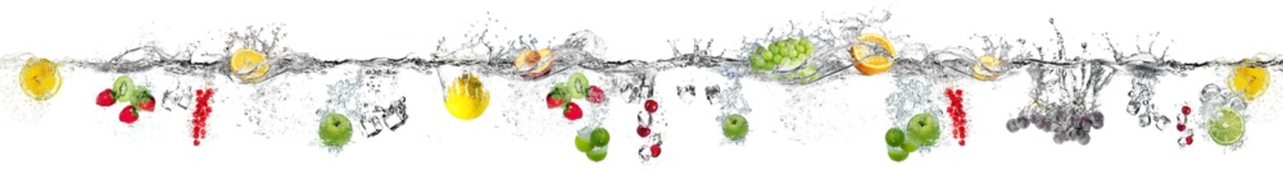 Fruits falling into water on a white background