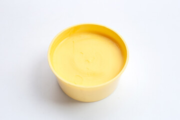 Margarine cheese butter on white.