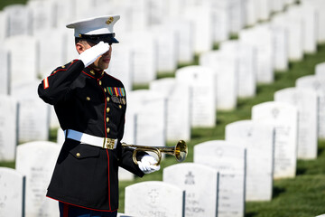 Honoring the Fallen: A Marine's Tribute at National Military Cemetery