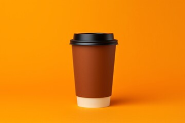a brown and white cup with black lid