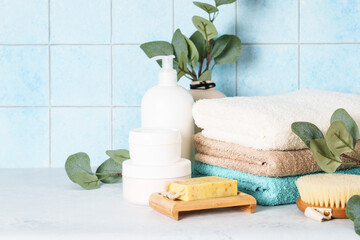 Bathroom with Cosmetic products and clean towels. Healthy lifestyle, relaxation, skin care.