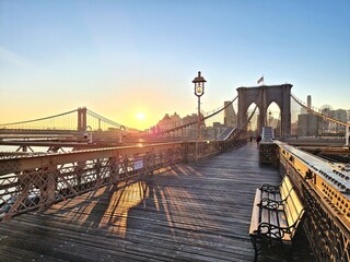 Brooklyn Bridge at sunrise in autumn at the beginning of a new day, New York