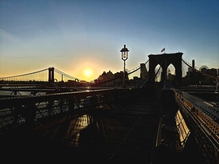 Brooklyn Bridge at sunrise in autumn at the beginning of a new day, New York	