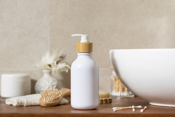 Cosmetic bottle near personal care products on wooden countertop in bathroom, mockup