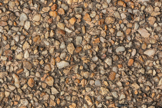 Blank concrete brown rough wall for background. Beautiful brown exposed aggregate wall plastered surface background pattern.