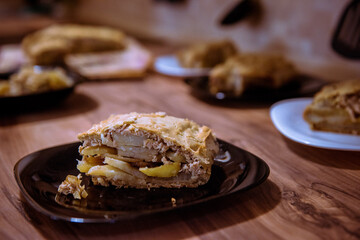 Kulebyak meat pie with filling on wooden table. Traditional Russian pastries - obrazy, fototapety, plakaty