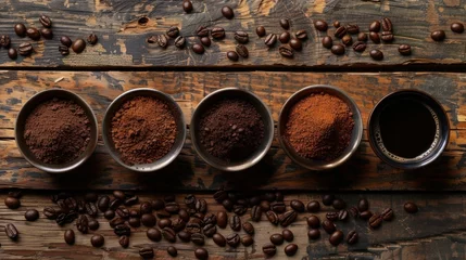  Coffee beans and coffee powder with hot coffee brewed on old wood. © matoya