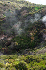 Naklejka na ściany i meble Surreal landscape of sulfur fumaroles at Terceira Island, Azores. Captivating natural wonders amid volcanic terrain.
