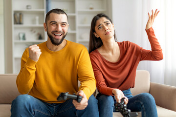 Happy couple enjoying video games